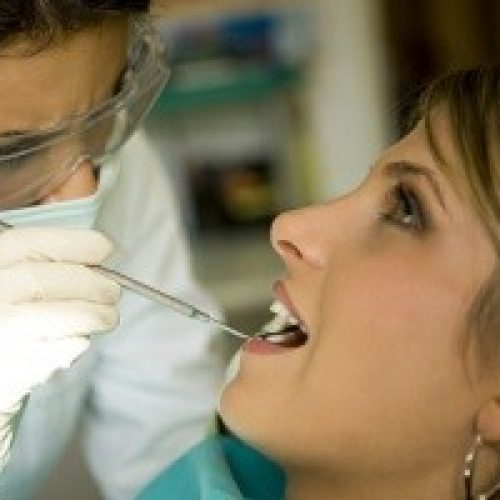 Female-Dentist-Doing-Exam-small